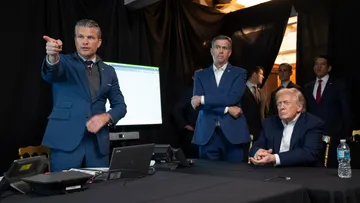 In this photo released by the White House, President Donald Trump monitors U.S. military operations in Venezuela with Defense Secretary Pete Hegseth and CIA Director John Ratcliffe, center, at Mar-a-Lago in Palm Beach, Fla., Saturday, Jan. 3, 2026.