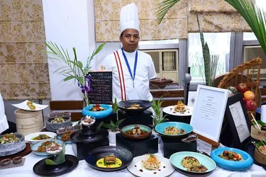 Chef showcasing a dish for the Master Chef Oriental Cuisine competition.