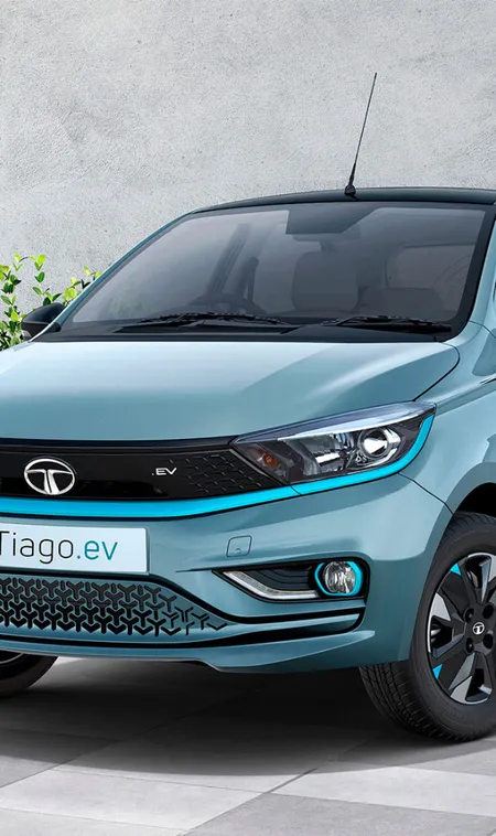 Tata-Tiago-EV-starts-at-₹7.99-lakh,-offering-250km-range-and-low-running-costs-for-city-driving.