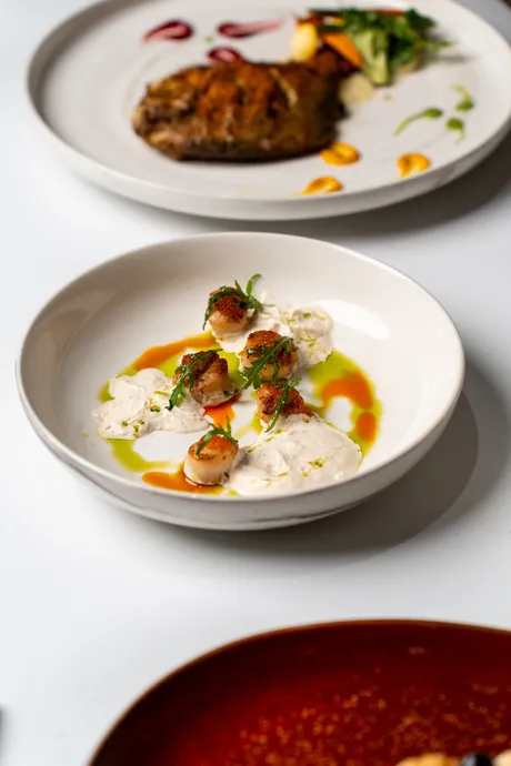 Seared Scallop, Salmon roe, Garlic espuma & Basil oil