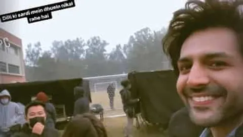 Kartik Aaryan shoots for Shehzada in Delhi's cold weather, says 'dhuein nikal gaye'. Watch