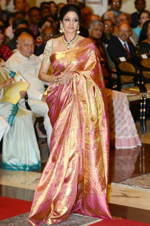 So lovely, puts a smile on your face. :) --- Sridevi in a gold and pink  double coloured silk saree, perfectly coordinated jewellery and mullapoo