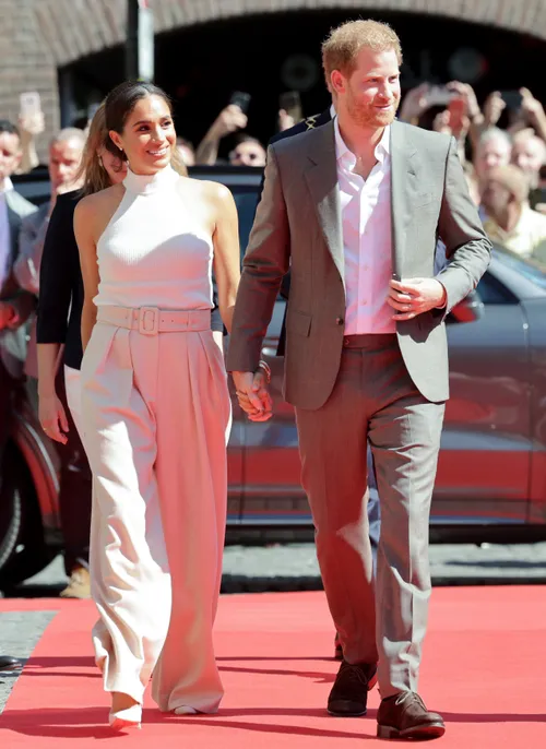 Meghan Markle Outfit Repeats in a White Tank Top and Pleated Pants | Marie  Claire