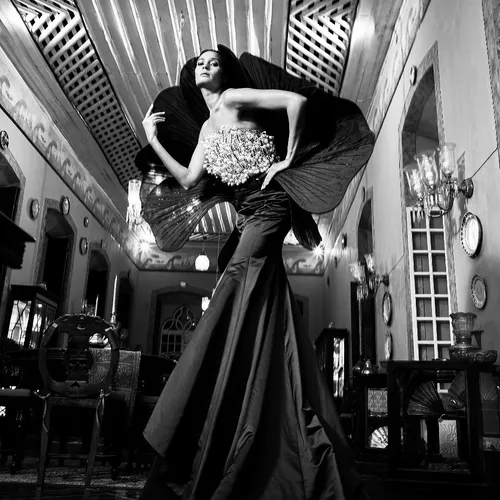 The Delight of Pure DramaThis black satin ensemble is inspired by the intensity of a moonless ni