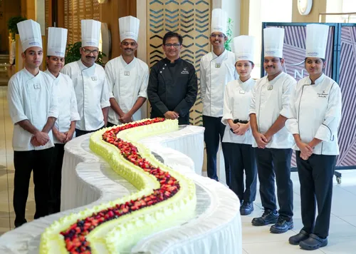 Chefs at Novotel Hyderabad Airport with the 25 Feet long cake at the Event