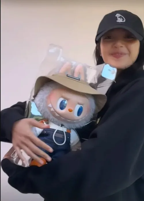 Blackpink's Lisa holds big Labubu 