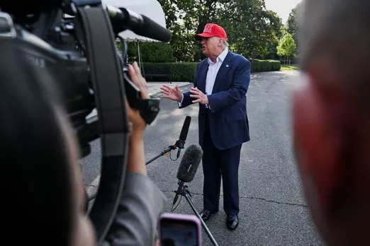 President Donald Trump speaks to the press on Tuesday before boarding Marine One on the South Lawn of the White House to depart for Florida on the South Lawn at the White House.