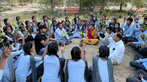 Prof Shyam Sunder Jyani with school students at a plantation drive