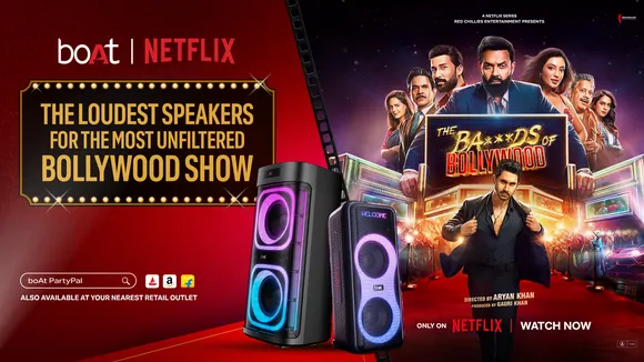 A group of actors from the Netflix show "The Ba***ds of Bollywood" are shown in a party setting, with a boAt PartyPal 700 speaker visible. The scene is dynamic and well-lit.