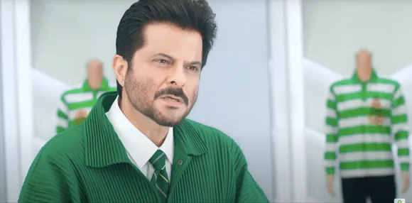 What exactly is Anil Kapoor doing in this Ariel ad?