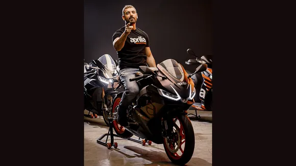 John Abraham revs an Aprilia bike twice in celebration of World Motorcycle Day and World Music Day
