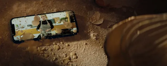 New iPhone ad shows the phone triumphing over the messes of a home chef