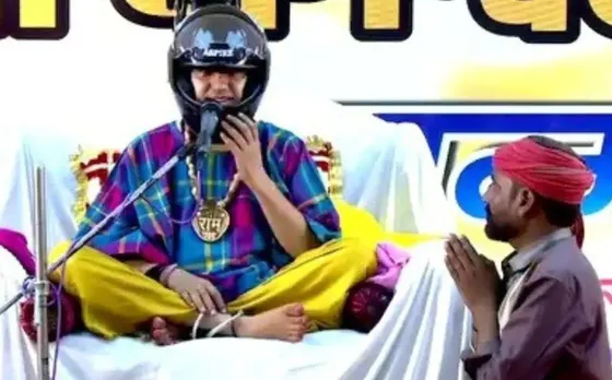 Bageshwar Dham: स्टेज पर अचानक हेलमेट पहनकर क्यों बैठ गए पंडित धीरेंद्र शास्त्री, जानें इसके पीछे की पूरी कहानी