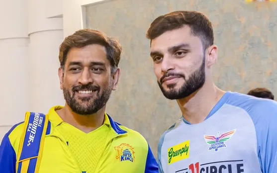 MS Dhoni with Naveen-Ul-Haq