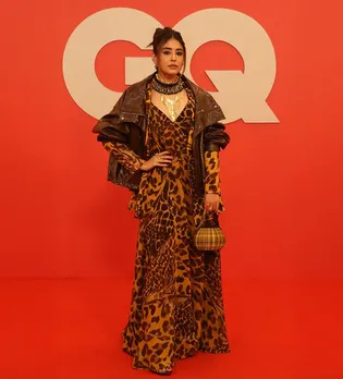 Image may contain Kritika Kamra Fashion Clothing Dress Adult Person Standing Formal Wear Accessories and Bag