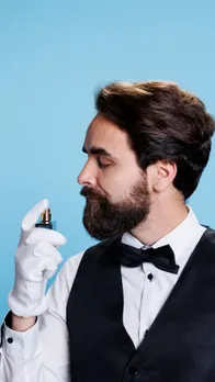 Man Spaying Perfume