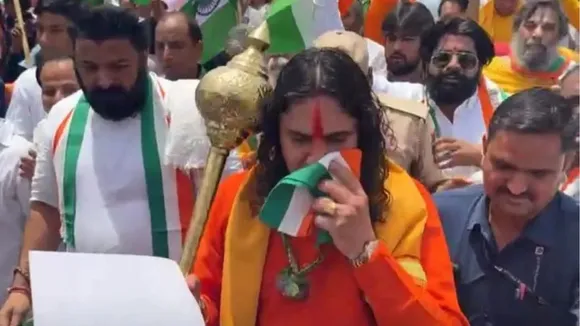 BJP MLA Balmukundacharya wipes sweat with Tricolour during Tiranga Yatra.