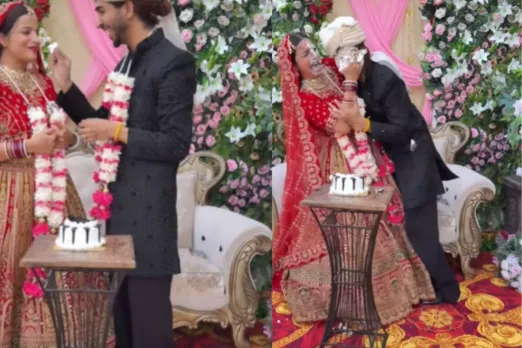 Groom and bride cutting cake 