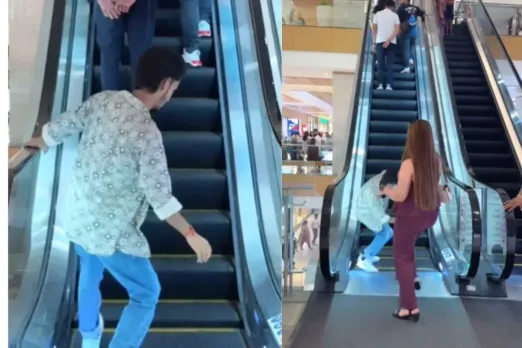 A girl hitting boy with her legs  on an escalator