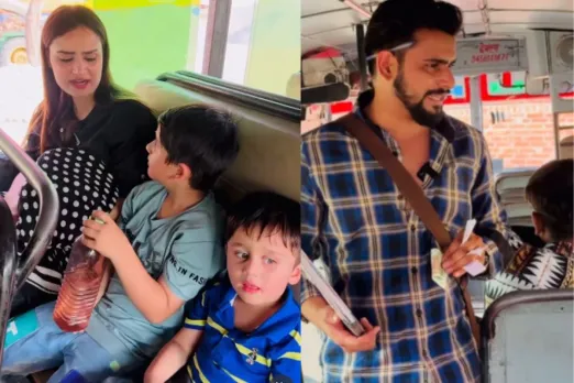 Woman travelling in a bus with three kids