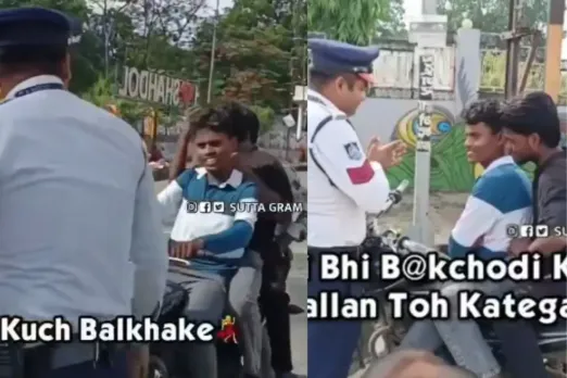 Traffic cop issuing challan to boys