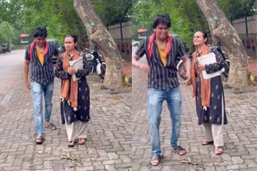 Young man eve teasing a lady maths teacher