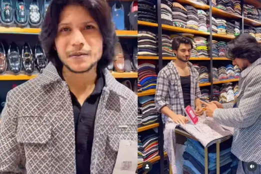 Shopkeeper using a technique to sell jacket