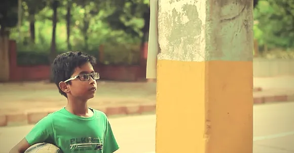 VIDEO: A Kid saw a poster on the street. What he did next will open your eyes to something beautiful.