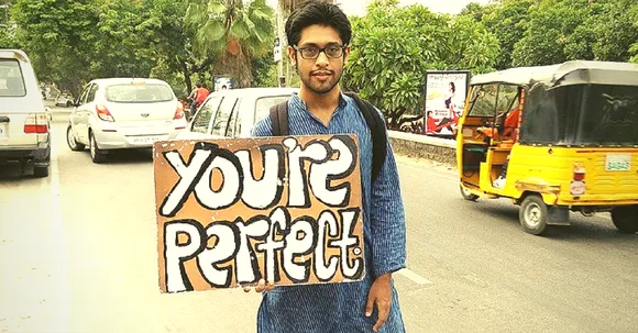 He Held One Placard from Pune to Estonia. Here's What Happened.