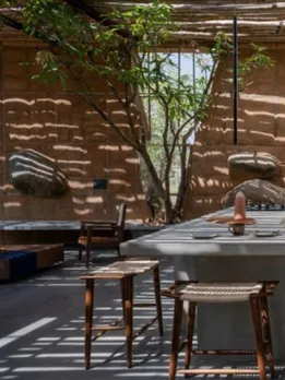 Couple's Weekend Home in the Middle of a Mango Farm Has Walls Made of Construction Debris
