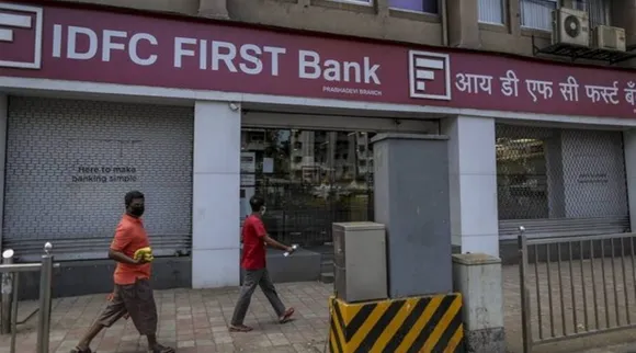 IDFC First Bank board favours merger with promoter entities IDFC Ltd IDFC Financial Holding