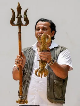 Man displays antique articles
