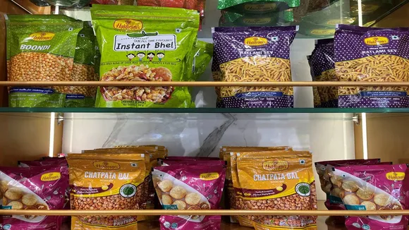 Tata, Tata Group, Haldiram's, snack maker, $10 billion valuation, snacks and sweets brand, Tata to expand consumer portfolio, Reuters, 51% stake in Haldiram's, Pepsi, Mukesh Ambani, Reliance Retail, Bain Capital, Tata Consumer Products, UK tea company, Tetley, Starbucks, Haldiram's Chief Executive, Krishan Kumar Chutani, Haldiram's bhujia, Euromonitor International, Lay's chips, Haldiram's restaurants, टाटा, टाटा समूह, हल्दीराम, स्नैक निर्माता, $10 बिलियन वैल्युएशन, स्नैक्स और मिठाई ब्रांड, टाटा कंज्यूमर प्रोडक्ट्स, रॉयटर्स, हल्दीराम 51% हिस्सेदारी, पेप्सी, मुकेश अंबानी, रिलायंस रिटेल, बेन कैपिटल, टेटली, स्टारबक्स, हल्दीराम सीईओ, कृष्ण कुमार चुटानी, हल्दीराम भुजिया, यूरोमॉनिटर इंटरनेशनल, लेज़ चिप्स, हल्दीराम रेस्तरां