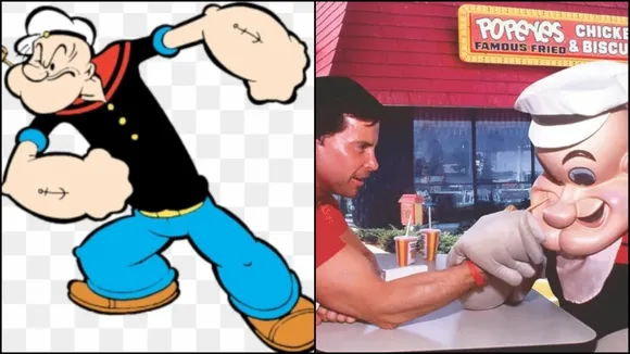 Popeye the Sailor, the cartoon character, is shown on the left. On the right, the founder is arm wrestling with a mascot of Popeye the Sailor, in front of a Popeyes Chicken restaurant.