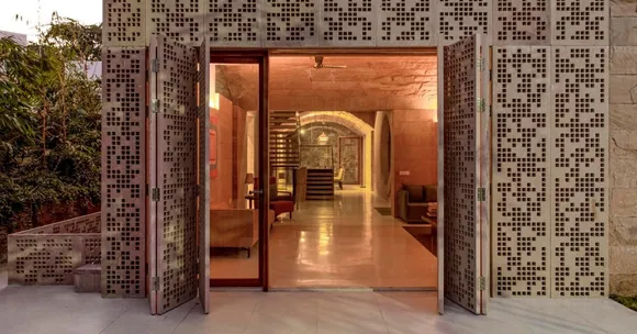 The lattice work ensures that light filters into the home without allowing the harsh sun