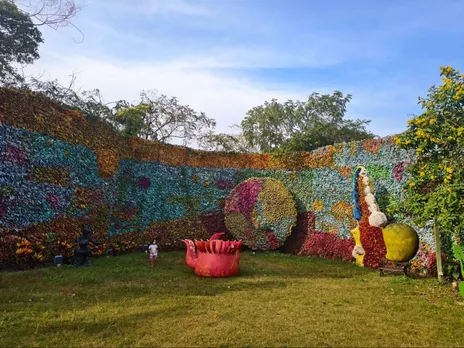 A vivid wall of recycled plastic bottles at Museum of Goa (MOG) — a colourful, up-cycled backdrop that turns discarded waste into a statement about sustainability and community responsibility.