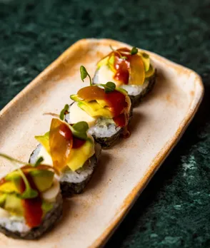 A plate of colourful sushi canape