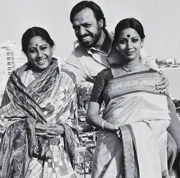 Smita Patil and Shabana Azmi in silk saris with Shyam Benegal, showcasing an early moment of Indian red carpet fashion at Cannes