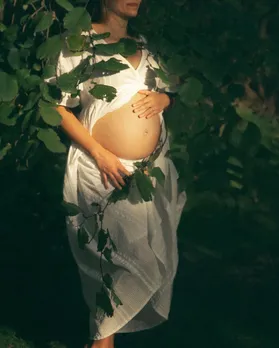 A picture of a pregnant woman reflecting women's reproductive health