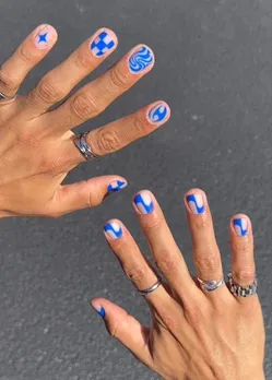 Blue and white nail art representing queer masculinity in India and how the country is redefining masculinity