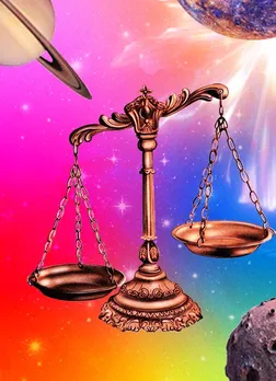Golden weighing scales hovering in a dreamlike space-scape, representing the Libra zodiac sign in the August 2025 horoscope visual series.