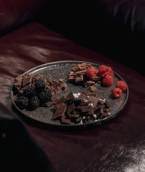 A plate full of memory-boosting foods like berries and dark chocolate
