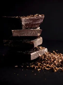 A stack of chocolates to depict the best dark chocolate brands in India like Pascati to show how Indian bean-to-bar chocolate are bringing about the era of chocolate gifting in India