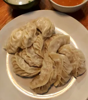 A picture of a plate of momo, the Indian street food Darjeeling, which has become a must-try Indian street food in different avatars all over the country