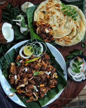A picture of a plate of beer fry and Malabar parotta, to show how this street food Kerala is one of the best street food India.