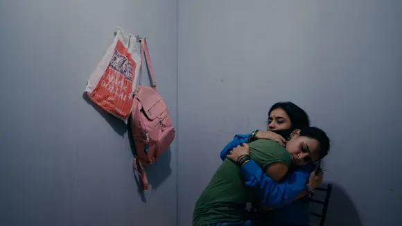 A still from a film where two women are hugging in a room, to show how queer love in Indian cinema is being represented, bringing about a change in romantic films in India
