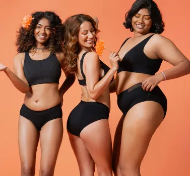Three women wearing black-coloured period panties in India