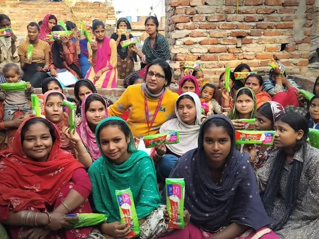 Social workers from Pinkishe Foundation distributing menstrual products in India