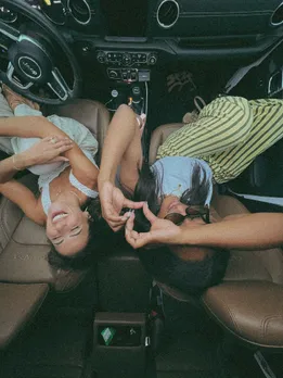 Two friends enjoying with each other in the car, reflecting that losing a best friend is tough