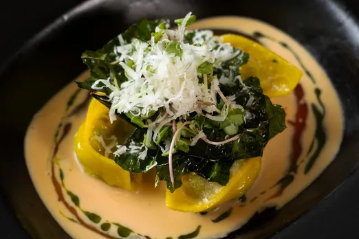 A picture of a tastefully placed dish on a sauce to show how vegetarian tasting menus India are leading vegetarian gastronomy India